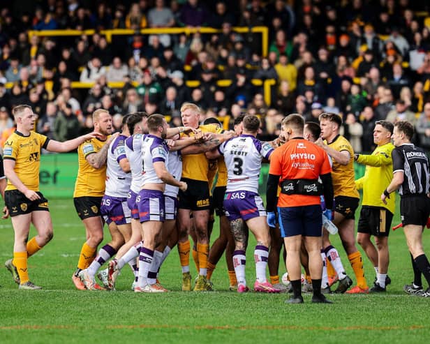Players clash during Castleford Tigers' Easter loss to Wakefield Trinity. Picture by Alex Whitehead/SWpix.com.
