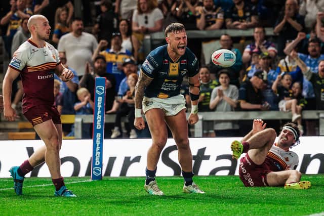 Leeds Rhinos' Chris Hankinson celebrates his try against Huddersfield Giants. Picture by Alex Whitehead/SWpix.com.