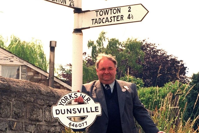 Colin Holt with his replica Yorkshire riding signs against an original at Saxton near Tadcaster in July 1996.