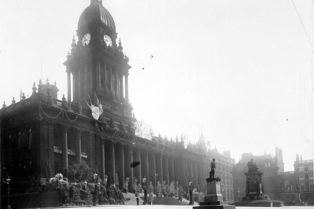 Leeds Town Hall decorated for the Royal visit. To the right are the Municipal Buildings, now Central Library and Art Gallery. The buildings on the extreme right were demolished to provide open space for War memorial.