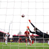 BOURNEMOUTH, ENGLAND - APRIL 30: Illan Meslier of Leeds United attempts to save a goal scored by Jefferson Lerma (not pictured) of AFC Bournemouth, his team's first goal during the Premier League match between AFC Bournemouth and Leeds United at Vitality Stadium on April 30, 2023 in Bournemouth, England. (Photo by Michael Steele/Getty Images)