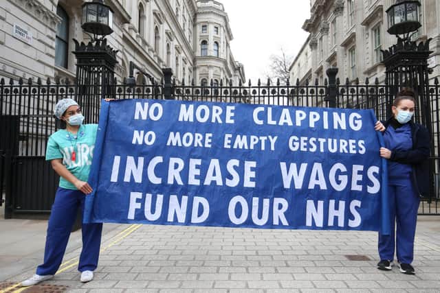 Nurses and NHS workers from the campaign group NHS Workers Say No, and Unite's Guys and St Thomas Hospital Union branch, hold a socially distanced protest outside Downing Street in London over the proposed 1% pay rise from the Government. (Pic: PA)