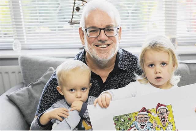 Home Is Where The Heart is family photo competition winner Paul Dishman with his grandchildren and Graeme Badeira prize