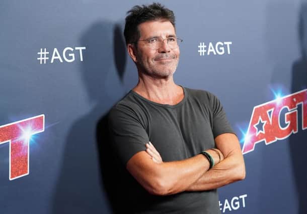 Simon Cowell has broken "parts of his back" following a bike injury (Photo: Rachel Luna/Getty Images)