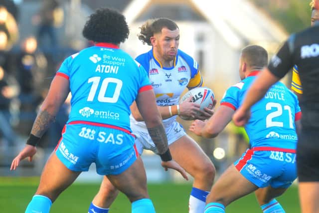 Captain Cameron Smith on the ball for Rhinos in their Boxing Day win over Wakefield. Picture by Steve Riding.