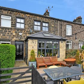 Nestled in the heart of the picturesque town of Yeadon, this enchanting three bedroom stone cottage is the epitome of charm and character.