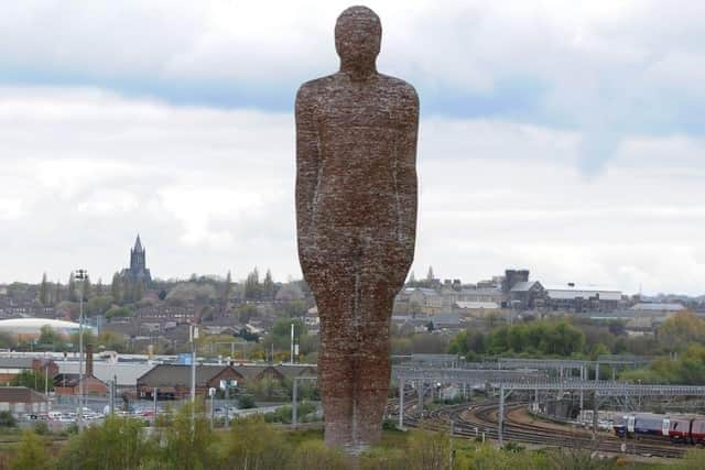 This mocked up photo demonstrates what The Brick Man could have looked like if it had been erected on theunused scrubland near Leeds city station.