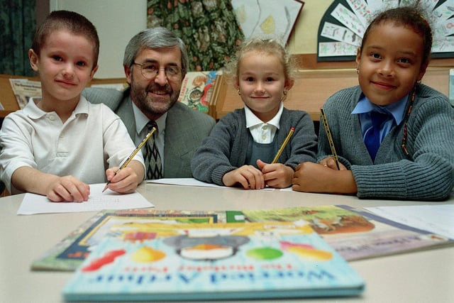 Beeston Hill Primary School were celebrating after receiving a very good report from Ofsted inspectors. Pictured, from left, are Jack Doyle, Eric Whitehouse (head teacher), Lucy Smith and Hollie Holdsworth-Watson.