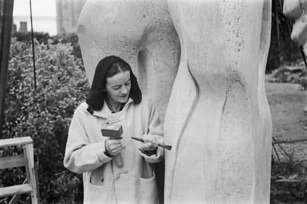 Barbara Hepworth working on her abstract stone sculpture, 'Contrapuntal Forms' in 1950.