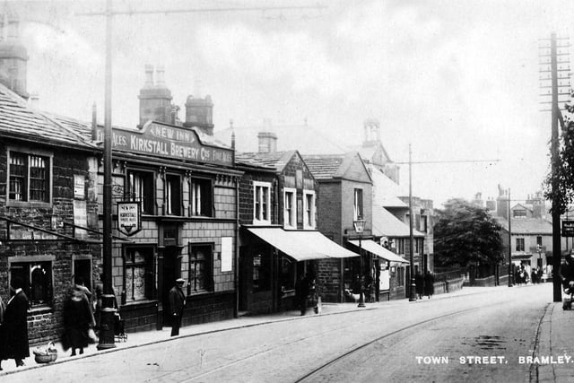 Upper Town Street looking south-east from a postcard with a postmark of June 29, 1937. Towards the left is the New Inn, a Kirkstall Brewery Company public house. On the right is a sign for Miss Roberts, confectionery (according to a Kelly's Directory of 1932, Miss Mary Roberts, pastry cook, was at no 251a).
