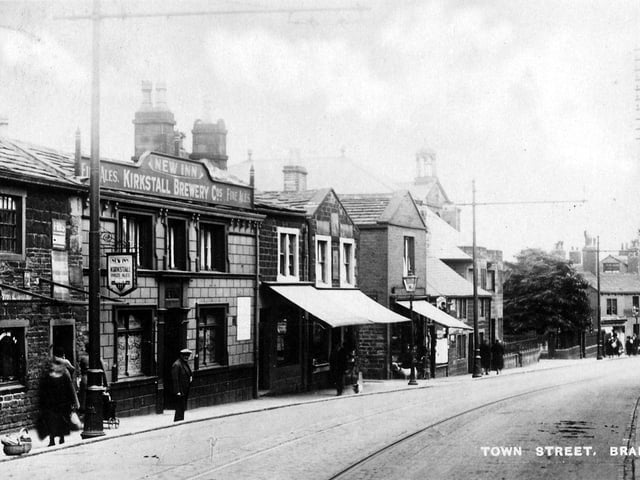 Upper Town Street looking south-east from a postcard with a postmark of June 29, 1937. Towards the left is the New Inn, a Kirkstall Brewery Company public house. On the right is a sign for Miss Roberts, confectionery (according to a Kelly's Directory of 1932, Miss Mary Roberts, pastry cook, was at no 251a).