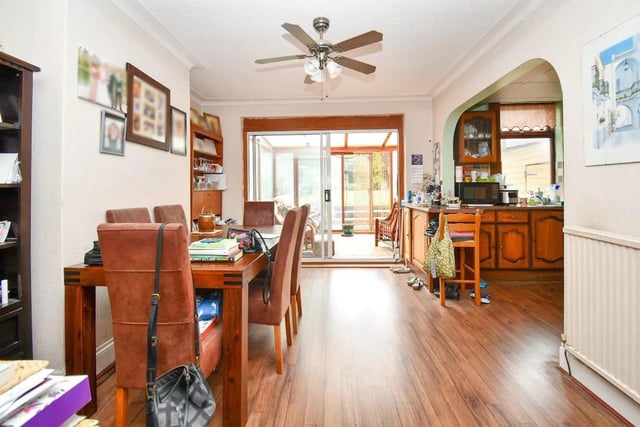 The property also boasts a spacious dining room, perfect for entertaining guests.
