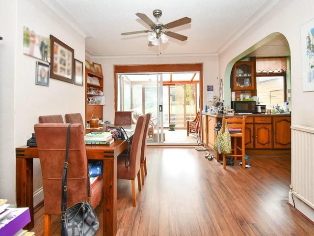 The property also boasts a spacious dining room, perfect for entertaining guests.