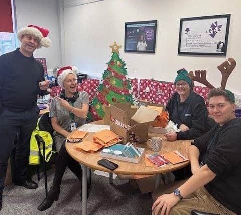 Lubrizol employees making Project Youth Cancer gift boxes