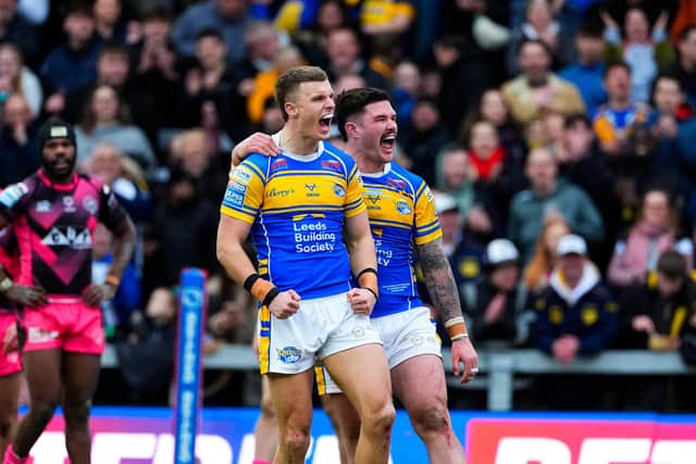Ash Handley, left, celebrates his try against Castleford Tigers with Leeds Rhinos teammate James Bentley. Picture by Olly Hassell/SWpix.com.