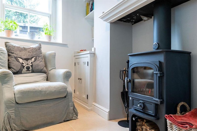 The log burner is a stunning feature of this period home.