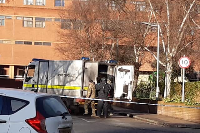 A member of the bomb squad is seen suiting up outside of St James's Hospital.