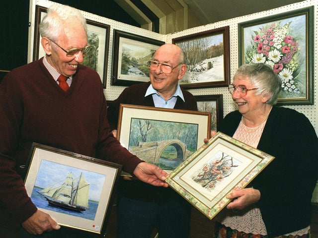 Members of the Alwoodley Art Group, from left, Barry Spencer, Alan Bond and his wife Brenda, discuss the merits of each others work at the group's Autumn Exhibition held in Alwoodley Community Centre in October 1996.