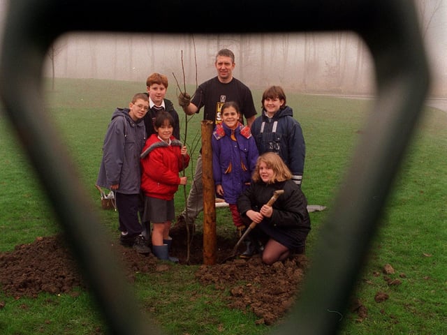 Pupils from Fieldhead Carr Primary joined in with the National Tree Planting Week by planting groups of trees around the school's grounds in November 1997. Pictured with their adopted Mountain Ash Tree, are, from left Chris Dearing, James Clifford and Rachel Stockley, David Mathews, a member of Skelton Wood Environment Group, Jodie Moon, Charlene Moon and Emma Lockwood.
