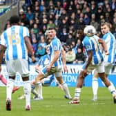 BAD DAY: For Leeds United star Crysencio Summerville, left, whose late strike hit the post in Saturday's 1-1 draw at Championship hosts Huddersfield Town, above.Photo by Ed Sykes/Getty Images.
