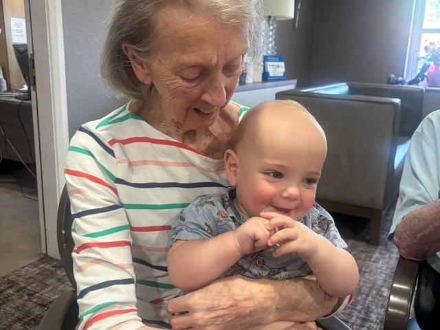 Resident at HC-One’s Windsor Court Care Home with child from Hartbeeps Mums and Baby Group