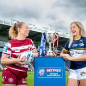 Rhinos' Caitlin Beevers and Mary Coleman, of Wigan, with the Women's Challenge Cup at Headingley, where Sunday's semi-final will be played. Picture by Allan McKenzie/SWpix.com.