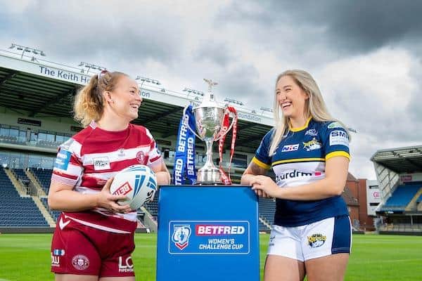Rhinos' Caitlin Beevers and Mary Coleman, of Wigan, with the Women's Challenge Cup at Headingley, where Sunday's semi-final will be played. Picture by Allan McKenzie/SWpix.com.