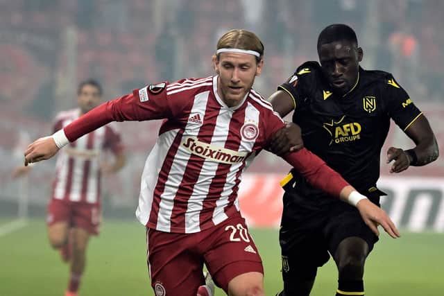 Olympiacos' English forward Josh Bowler (L) fights for the ball with Nantes' French defender Dennis Appiah (R) during the UEFA Europa League Group G football match between Olympiakos (GRE) and Nantes (FRA) at Stadio Georgios Karaiskakis in Piraeus on November 3, 2022. (Photo by ARIS MESSINIS / AFP) (Photo by ARIS MESSINIS/AFP via Getty Images)