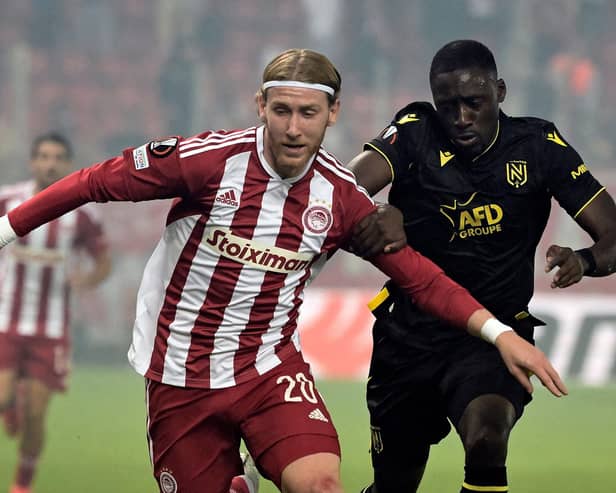 Olympiacos' English forward Josh Bowler (L) fights for the ball with Nantes' French defender Dennis Appiah (R) during the UEFA Europa League Group G football match between Olympiakos (GRE) and Nantes (FRA) at Stadio Georgios Karaiskakis in Piraeus on November 3, 2022. (Photo by ARIS MESSINIS / AFP) (Photo by ARIS MESSINIS/AFP via Getty Images)