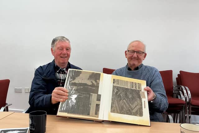 Retired firefighters in the photos - Trevor Leighton and Norman Field, holding Trevor's scrapbook.