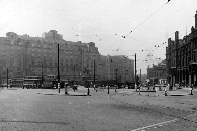 The new Queens Hotel is in the background. In the foreground are trams, tramlines, traffice islands and shelters. The Black Prince statue and part of the General Post Office are visible. Pictured in July 1942.