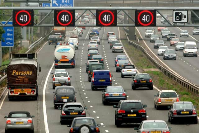 Motorists drive on the hard shoulder of one of the busiest stretches of motorway in Britain between junctions 3 and 7 of the M42