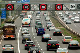 Motorists drive on the hard shoulder of one of the busiest stretches of motorway in Britain between junctions 3 and 7 of the M42
