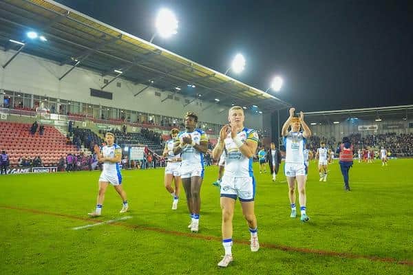 Harry Newman leads the celebrations following Leeds Rhinos' win at Leigh Leopards. Picture by Olly Hassell/SWpix.com.