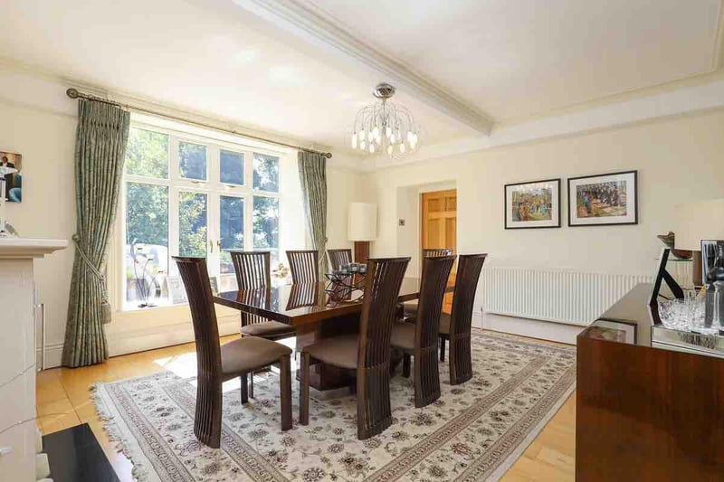 The dining room is a lovely space to entertain friends. The feature window offers lots of light.