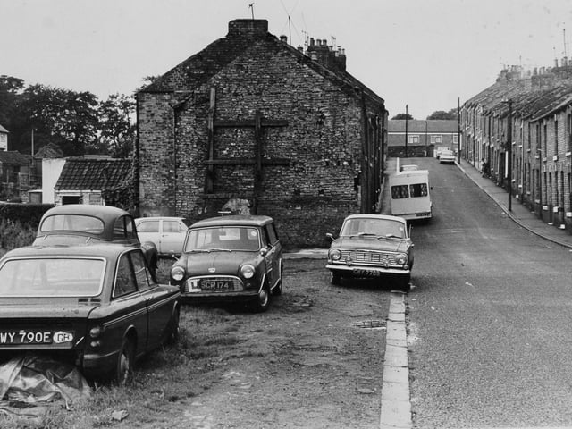 Lickley, shored up house end which residents were complaining was an eyesore in September 1974.