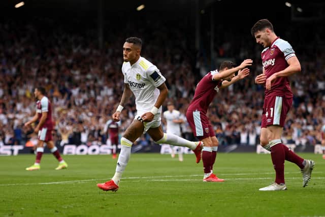 LEEDS, ENGLAND - SEPTEMBER 25: Raphinha of Leeds United celebrates after scoring their side's first goal during the Premier League match between Leeds United and West Ham United at Elland Road on September 25, 2021 in Leeds, England. (Photo by Stu Forster/Getty Images)
