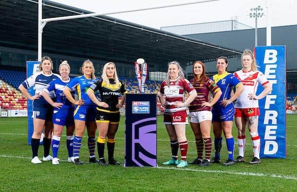 Players from the eight Women's Super League teams at this week's competition launch in York. Left to right: Featherstone's Brogan Churm, Barrow's Jodie Litherland, Leeds' Shona Hoyle, York's Sinead Peach, Wigan's Rachel Thompson, Huddersfield's Bethan Oates, Warrington's Katie May Williams, St Helens' VIcky Whitfield.  Picture by Allan McKenzie/SWpix.com.