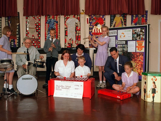 Children with musical instruments at Alwoodley Primary  pictured in July 1996. Pictured, from left,  on drums Doug Thompson, Alison Harrison from Sainsburys, (centre,kneeling down) Carolyn Pattenden (in charge of the orchestra, right) and Lee Finster, customer Service Manager at Sainsburys.