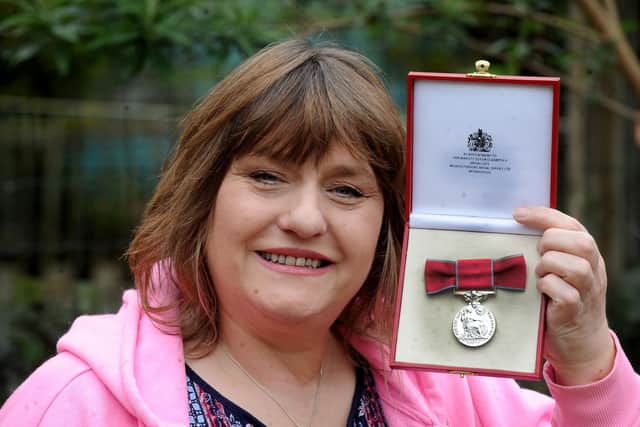 Rowenna Garrard-Brown, pictured with her British Empire Medal.