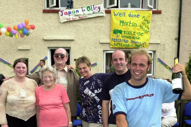 Cyclist Martin McKeown is welcomed back to Otley in June 2003 by his family after he arrived from Japan.