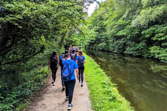 The Mednet team walking on the canal