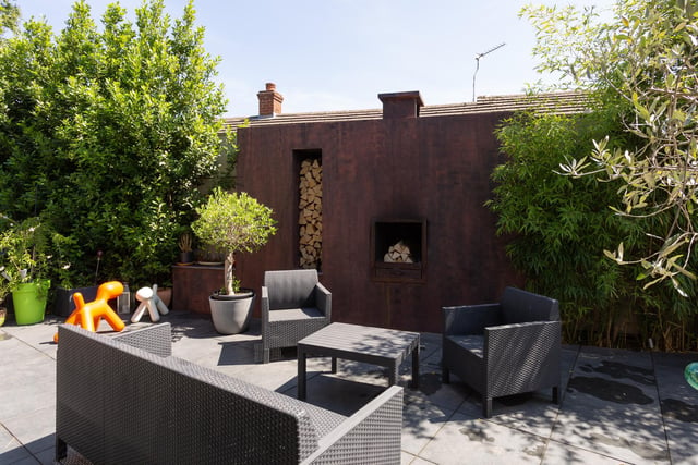 The thoughtfully designed garden sits to the rear and side of this corner property, beautifully created to offer several sections of living space to suit the mood or occasion.