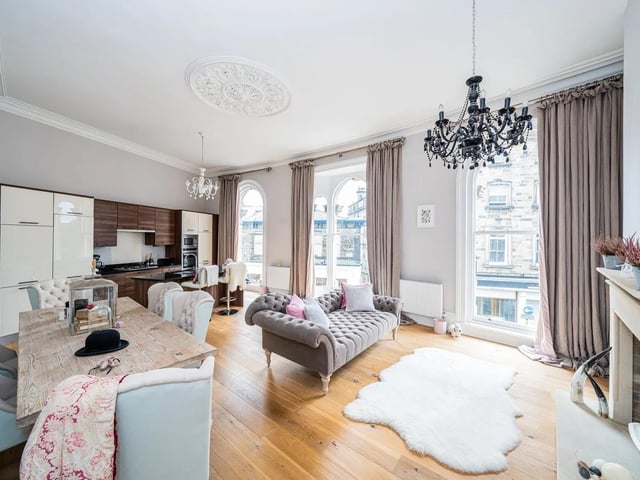 Floor to ceiling arched windows give amazing views and light up the room in this Harrogate flat .