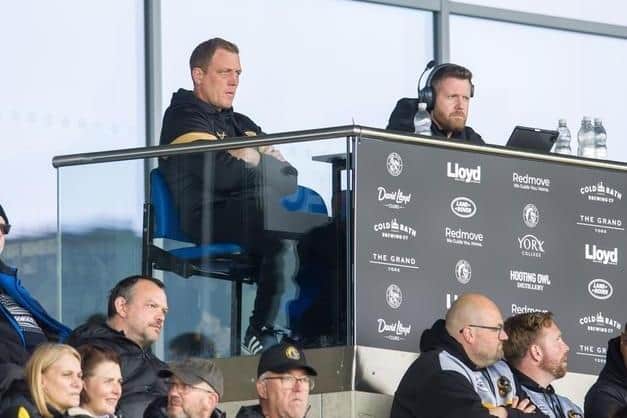 Castleford Tigers coach Ryan Carr, left, watches his side in action at York Knights. Picture by Tony Johnson.