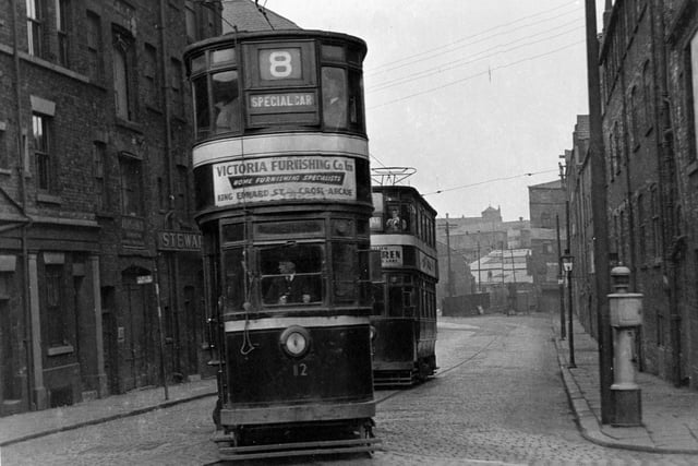 The number 8 special trundles down Sovereign Street in April 1955. Stewarts and Lloyds Ltd tubes, fittings and manufacturers can be seen on the left.