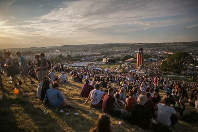 People gather to watch the sun set at Glastonbury 2014 (Photo: Matt Cardy/Getty Images)