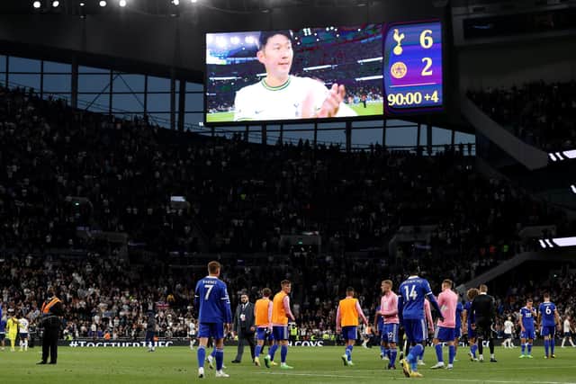 HIT FOR SIX: Leicester City's players head off the pitch after Saturday evening's heavy defeat at Tottenham Hotspur for whom Son Heung-Min, pictured on the big screen, bagged a rapid hat-trick. Photo by Ryan Pierse/Getty Images.