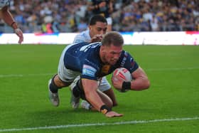 Tom Holroyd scores, for the third successive game, during Leeds Rhinos 46-0 win against Toulouse Olympique. Picture by Steve Riding.