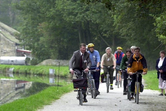Supporters ride along the newly- restored towpath between Leeds and Saltaire on the Leeds and Liverpool Canal.